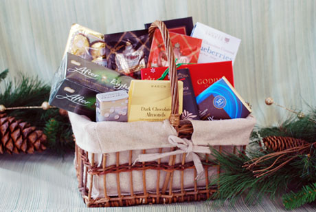 The Chocoholics Basket contains an array of gourmet chocolate items that will satisfy even the biggest sweet tooth. Chocolate covered almonds, a selection of Godiva dark chocolates, chocolate covered blueberries, hot cocoa, chocolate mint cookies and more.