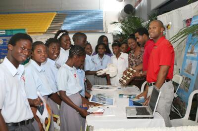 deaf centre careers bahamas fair atlantis marcia dolphins booth encounter teacher thomas along students during visit