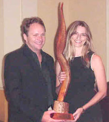 John Christie (HG Christie Ltd.) being presented the Best of The Bahamas Award from Lisa Wells (Benelda.com Web Design)