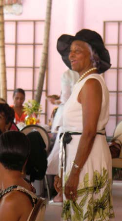 Jane Adderley models her Sunday best attire, equipped with an Easter Hat and pearls, that she said gives the older person a youthful feel and appearance (BIS Photo / Gena Gibbs).