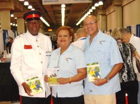 Bahamian representatives display a special sports tourism brochure that promotes sports tourism venues and services.
