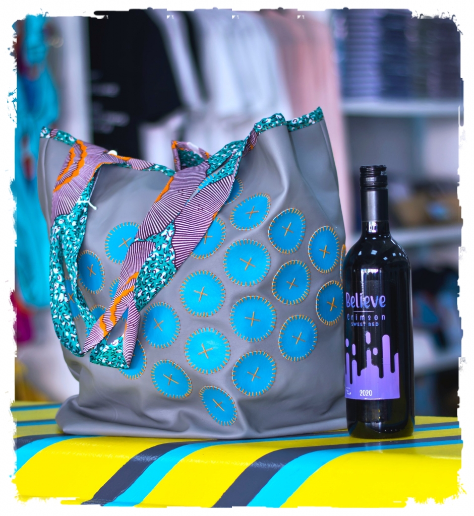 Gray and Blue hand bag & Believe Wine