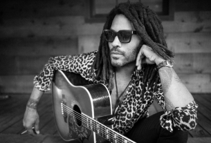 Image of Lenny Kravitz hilding guitar